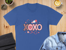 Load image into Gallery viewer, Blue t-shirt with "XOXO" graphic featuring hearts, stethoscope, and pills.