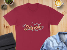 Load image into Gallery viewer, Maroon t-shirt with "Nurse" text and stethoscope heart graphic.