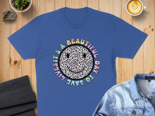 Load image into Gallery viewer, Blue t-shirt with "It's a beautiful day to save lives" and leopard print smiley face.