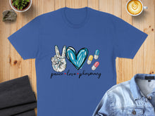 Load image into Gallery viewer, Blue t-shirt with "Peace Love Pharmacy" text and pill graphics.