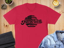 Load image into Gallery viewer, Red t-shirt with "America Est. 1776" text and US flag design.