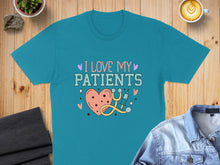 Load image into Gallery viewer, Teal t-shirt with "I Love My Patients" and heart-shaped medical graphic.
