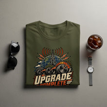 Load image into Gallery viewer, Olive green t-shirt with "UPGRADE COMPLETE" graphic featuring a globe and antennas.