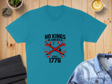 Load image into Gallery viewer, Teal t-shirt with "NO KINGS SINCE 1776" text and crossed axes design.
