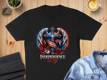 Load image into Gallery viewer, Black t-shirt with patriotic cross, wings, roses, and "Independence Day" text.