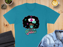 Load image into Gallery viewer, Turquoise t-shirt with cartoon nurse, "Trauma Queen" text, butterflies, and flowers.