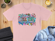 Load image into Gallery viewer, Pink t-shirt with "She works willingly with her hands" graphic and medical icons.