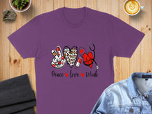Load image into Gallery viewer, Purple t-shirt with peace sign, heart, stethoscope, and text: Peace Love Scrub.