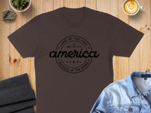 Load image into Gallery viewer, Brown t-shirt with "America, Land of the Free Since 1776 Because of the Brave" text.
