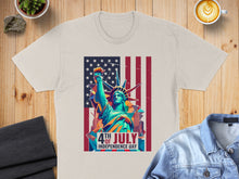 Load image into Gallery viewer, Statue of Liberty and US flag graphic on a cream t-shirt.