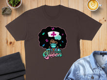 Load image into Gallery viewer, Brown t-shirt featuring cartoon nurse with afro and "Trauma Queen" text.