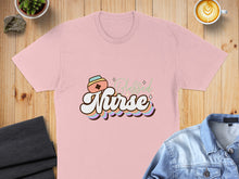Load image into Gallery viewer, Pink t-shirt with "Blessed Nurse" text in colorful, retro font.