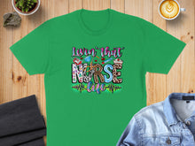Load image into Gallery viewer, Green t-shirt with "Lovin' that nurse life" text and medical icons.
