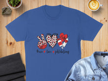 Load image into Gallery viewer, Blue t-shirt with peace, heart, and phlebotomy symbols and text.