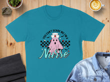 Load image into Gallery viewer, Teal t-shirt with "You Can't Scare Me I'm a Nurse" ghost graphic.
