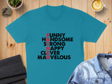 Load image into Gallery viewer, Teal t-shirt with "FUNNY HANDSOME STRONG HAPPY CLEVER MARVELOUS" text.