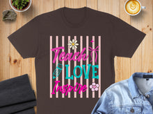 Load image into Gallery viewer, Brown t-shirt with "Teach Love Inspire" text and floral graphics.