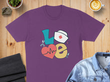 Load image into Gallery viewer, Purple t-shirt with "LOVE" design featuring heart, stethoscope, and nurse hat.