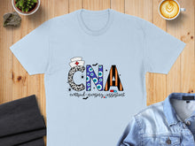 Load image into Gallery viewer, Light blue t-shirt with Halloween-themed "CNA Certified Nursing Assistant" graphic.