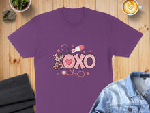 Load image into Gallery viewer, Purple t-shirt with "XOXO" graphic featuring stethoscope and medical elements.