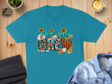 Load image into Gallery viewer, Teal t-shirt with "Med Tech CREW" in colorful leopard print and medical icons.