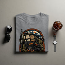 Load image into Gallery viewer, Gray t-shirt with illustration of a backpack filled with radio equipment and a landscape.