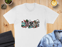 Load image into Gallery viewer, White t-shirt with "NURSE" text in colorful, distressed lettering and stethoscope.