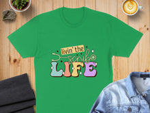 Load image into Gallery viewer, Green t-shirt with "livin' the scrub life" text and stethoscope.