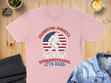 Load image into Gallery viewer, Bigfoot celebrating America's Semiquincentennial 1776-2026 on a pink t-shirt.