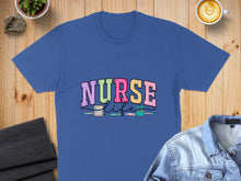 Load image into Gallery viewer, Blue t-shirt with "NURSE LIFE" text and medical icons.