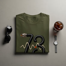 Load image into Gallery viewer, Olive green t-shirt with black cable forming the number 73 and a waveform.