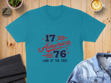 Load image into Gallery viewer, Teal t-shirt with "1776 America Land of the Free" graphic.