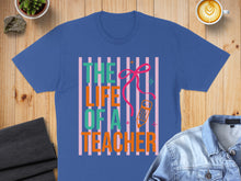 Load image into Gallery viewer, Blue t-shirt with "The Life of a Teacher" text and a pencil.
