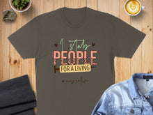 Load image into Gallery viewer, Gray t-shirt with "I stab people for a living #nurselife" text and a syringe icon.