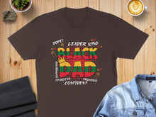 Load image into Gallery viewer, Black Dad text art with crown and stars on a dark brown t-shirt.