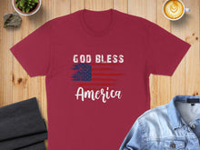 Load image into Gallery viewer, Burgundy t-shirt with "God Bless America" and American flag graphic.