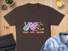 Load image into Gallery viewer, Brown t-shirt with "Peace Love Nursing" text and nursing icons.