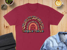 Load image into Gallery viewer, T-shirt with "Hospice Nurse Making a Big Difference" text and rainbow heart graphic.