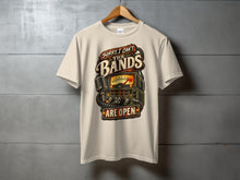 Load image into Gallery viewer, Cream t-shirt with vintage radio and microphone graphic, "Sorry I can't, the bands are open."