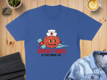 Load image into Gallery viewer, Blue t-shirt with pumpkin face, band-aids, and "Spooky Vibes & That Nurse Life" text.