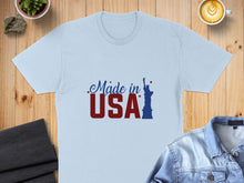 Load image into Gallery viewer, Light blue t-shirt with "Made in USA" text and Statue of Liberty graphic.