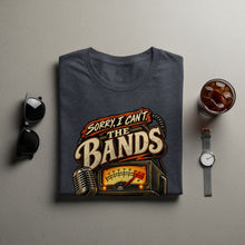 Load image into Gallery viewer, Dark gray t-shirt with "Sorry, I Can't. The Bands" graphic featuring a microphone and radio.