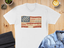 Load image into Gallery viewer, White t-shirt featuring a distressed American flag patch with fabric textures.