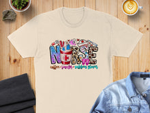 Load image into Gallery viewer, T-shirt with "NURSE" text and symbols for coffee, scrubs, and rubber gloves.