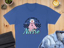 Load image into Gallery viewer, Blue t-shirt with ghost nurse graphic and "YOU CAN'T SCARE ME I'M A Nurse" text.