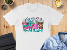 Load image into Gallery viewer, White t-shirt with colorful coffee cups and medical icons.