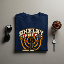 Load image into Gallery viewer, Navy t-shirt with "Shelby Hamfest" and radio tower graphic.