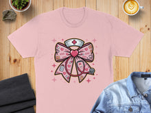 Load image into Gallery viewer, Pink t-shirt with a bow, stethoscope, and heart design.