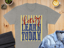 Load image into Gallery viewer, Grey t-shirt with "Let's LEARN TODAY" text and red bow design.
