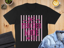 Load image into Gallery viewer, Black t-shirt with "Teacher Mode" text and a power switch.